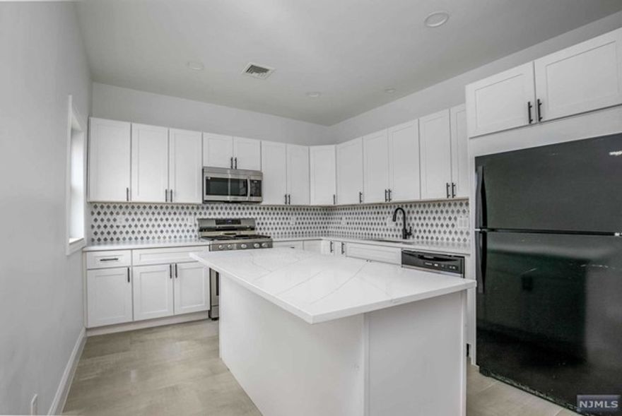 ALL NEW EVERYTHING! Here is your opportunity to rent a full house all to yourself in Little Ferry! The home has just finished its beautiful renovation and has been made new from full interior to exterior. A gorgeous open concept kitchen with living room is a wonderful space to relax or entertain. Sliding doors open up to the deck where your fenced in backyard awaits. Main bath has a gorgeous new shower in a completely new bathroom. Upstairs features 3 bedrooms and the 4th bedroom is located on the 3rd floor. The basement features stackable washer dryer and storage area. Driveway included. New HVAC and heat system with 2 zones to make you extra comfortable. New roof, siding, windows, nothing to do but move in!