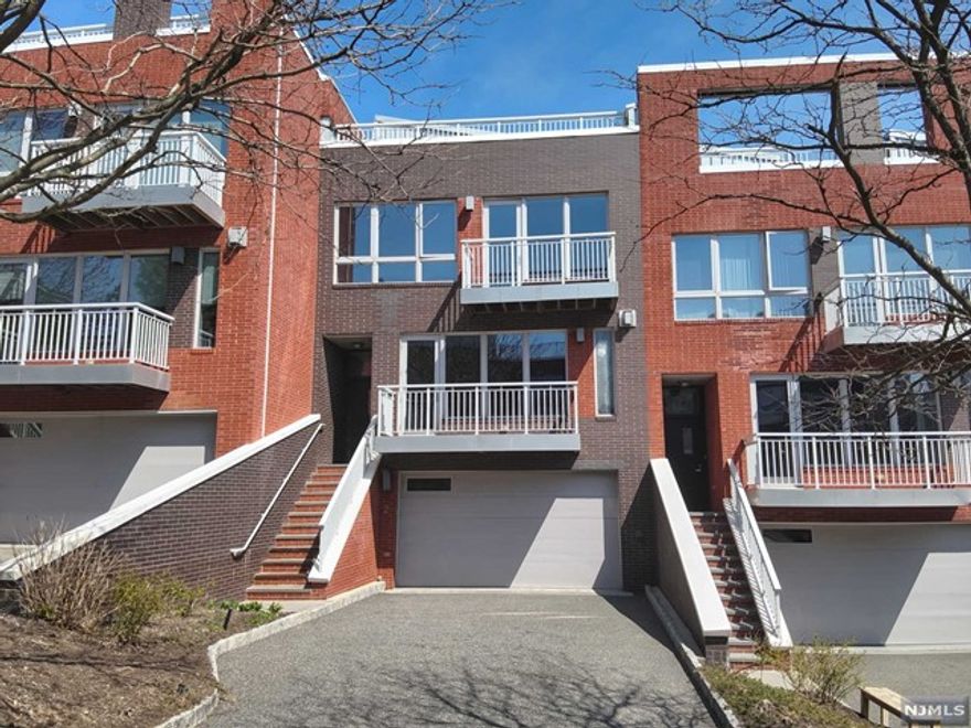 Whether relaxing in your solarium in the sky or barbecuing on the rooftop deck, you'll be enjoying spectacular views of NYC and the mighty Hudson River. Other features include 4 spacious bedrooms, 3.1 luxurious bathrooms, 3 floors of grandiose living, over-sized garage, private balconies, elevator and so much more. This place offers it all. Don't wait...schedule your private tour today!