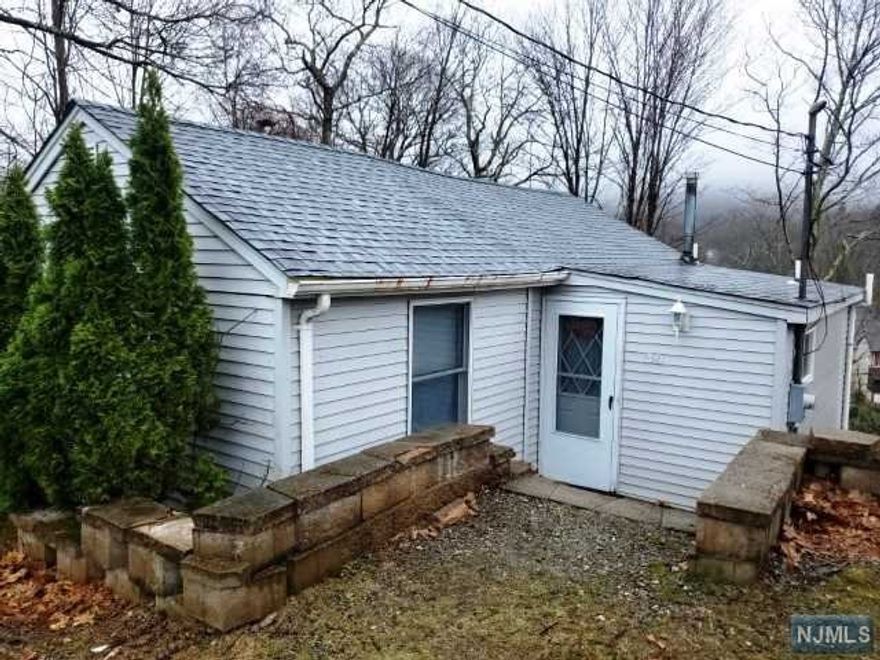 Charming 2 bedroom, 1 bath ranch home in Upper Greenwood Lake neighborhood. The first floor features living/dinign room, kitchen, 2 bedrooms and bath. Sliders from the living room lead to a spacious sunroom with woodburning fireplace, sliders to deck and spiral stairs to the ground floor. The ground floor offers finished area plus laundry, utilities, storage and door to rear yard. A wonderful place to call home! Tenant responsible for all utilities including propane, 1 1/2 month security, 1 month realtor fee and tenant insurance.