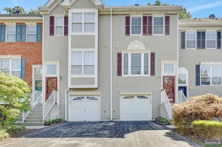 You're going to need to run and grab this one! This location backs to a private wooded setting, offers more parking than you will know what to do with, and a spacious and attached garage. Kitchen was recently upgraded with stainless steel appliances, quartz countertops, flooring and cabinetry with built-in coffee bar and under cabinet lighting. First floor has living room with hardwood flooring, updated powder room, fireplace, and access to the spacious patio overlooking the woods. 2nd level offers a large master suite with newer bath and oversized shower stall, guest bedroom with double closet, and a separate laundry room. Basement is finished and spacious; ideal to work from home or to use as a playroom/family room. Other upgrades include new Renewal by Anderson windows and patio door, high efficiency Lenox HVAC system, 3 stage whole house water filtration system, and a new premium water heater. Enjoy the pool, tennis courts, and playground. Close to transportation and shopping.