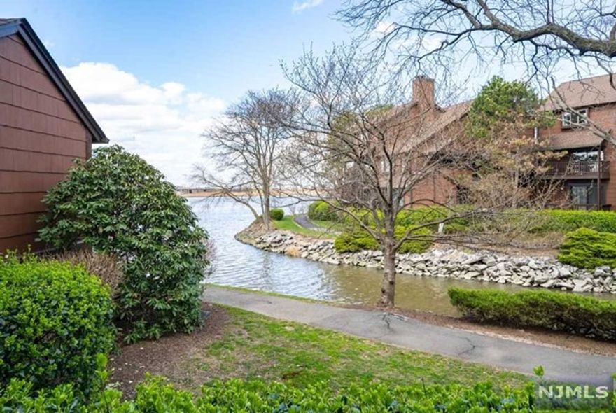 Located at the tip of the Secaucus Riviera sits this well kept Yarmouth townhome. Beautiful wooden floors are featured throughout, along with 2 bedrooms/1.5 baths. Kitchen has been updated with an open concept looking out at the dining room. Working wood fireplace along with a new water heater. Covered parking for one car and tandem parking for the second car. Carport has a big storage room for can easily accommodate carriages or bikes. Community offers terrific amenities featuring an outdoor pool, playground, basketball court and tennis and pickleball courts as well as a marina. Also included is a meet and greet Cove club bar. One does not have to leave the community--it's all here for you to enjoy. Great & convenient location, easy NYC commute w/transportation on site.