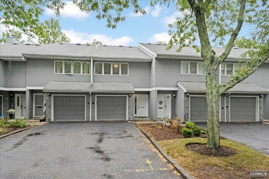 Multi-level townhome, in Essex Green Villas, Conveniently located near shopping, dining, major highways and NYC transportation. This bright ad light townhome features a NEW 2022 Kitchen with stainless steel appliances, large Living Room with high ceilings and a wood-burning fireplace- perfect for entertaining. Step out the sliders to a private patio and wooded views. Second Floor features two large bedrooms and 2 Baths. The Primary suite has a dressing area with double closets and a full bath. The finished basement features work from home office space, large closet, Full Bath and Laundry Room..This townhome provides access to the built-in garage off Large Entry foyer. There is plenty of parking: exclusive driveway and visitor parking. There is a community clubhouse with outdoor pool and exercise facility. If look gin for simple townhome living - be sure the check this one out! A wonderful unit listed at a great price in a great location!