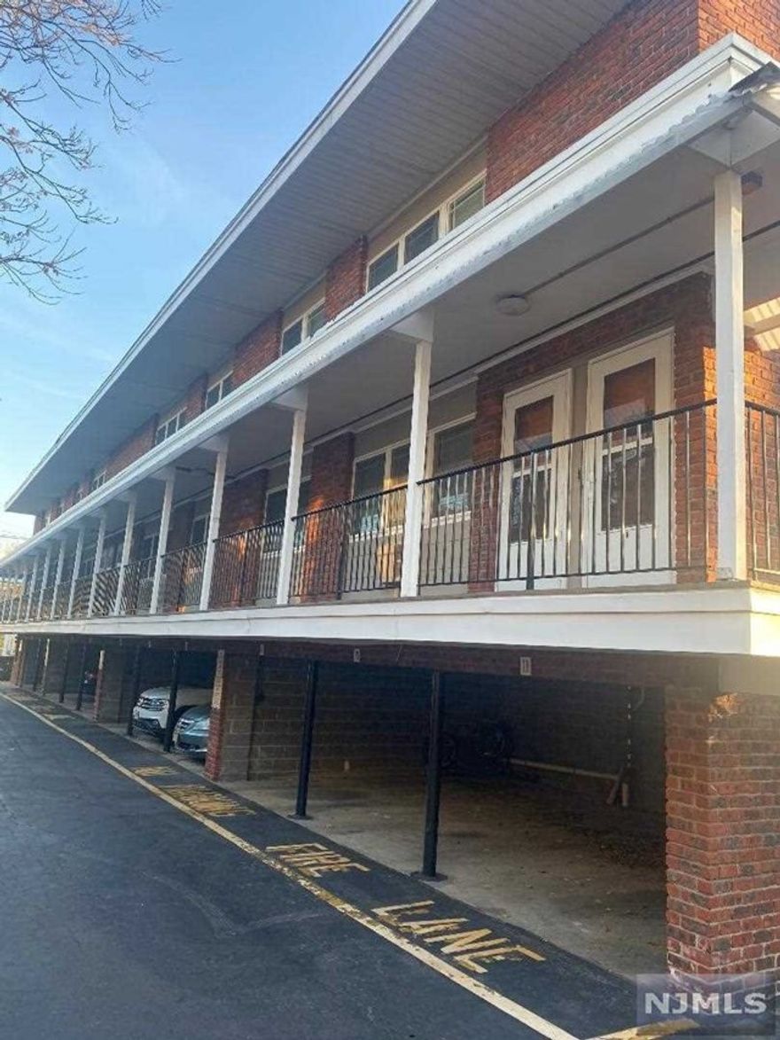 This clean smoke free one bedroom apartment has good room sizes gleaming hardwood floors and an updated bathroom. Covered one car garage included (additional garage space for $50/month. Coin operated laundry on premises. Convenient downtown location to NYC Transportation shopping and banking. No Pet