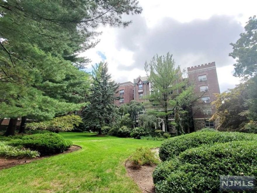 This beautiful freshly painted condo is one of the biggest 1bd units at the impressive pre-war Tudor complex "The Dwight Manor". Surrounded by gorgeous landscapes, the apartment located on the 1st floor, faces the garden and courtyard. It features hardwood floors throughout, high ceilings with recessed lights, Very spacious living room with wood burning fire place, renovated bathroom, large bedroom with plenty of closet space and renovated kitchen w/ big built in pantry, lots of cabinet space, stainless steel appliances and private dining area. In the building - laundry room at the same level as the apartment and gym. Located on Englewood East Hill it is close to downtown Englewood with restaurants, stores, Bergen PAC Theater, NJ major highways and easy NYC transportation at your door step.