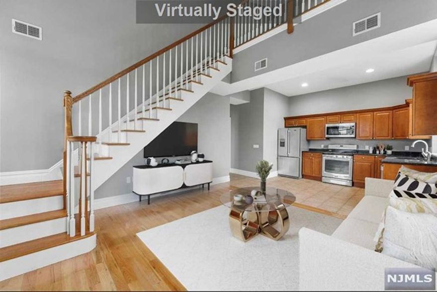 Welcome home to this beautiful penthouse offering two floors living space. First floor features a open layout with a fully renovated kitchen, full bathroom, living room and dinning room as well as a very spacious bedroom. Second floor features a office space as well as master bedroom with two very spacious closets and full bathrooms. In unit laundry utility and extra storage closets. There are 2 assigned parking spaces in a secured parking lot. Additional private storage in the basement and secured elevator building.