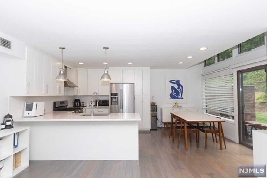 Beautifully updated and well maintained 2br/1.5ba 2 story townhouse in LEONIA. Walking distance to NYC bus, schools, parks, and shopping. Modern open floor plan, Central AC/Heating system, hardwood floors throughout, in unit W/D, private patio for outdoor entertaining, and extra storage.