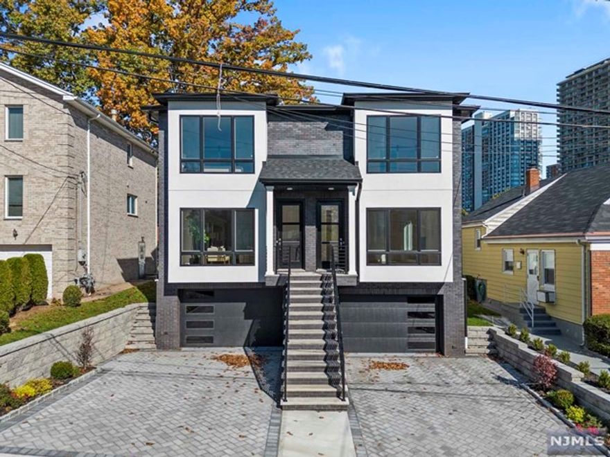 Priced to Sell. Welcome to 211 Slocum. A Brand New South Facing Townhome. This Modern Home features Quality Finishes and Luxurious Designs Inside and Out. Main Floor Features Living Room with Fireplace, Formal Dining Room, Modern Kitchen with High End Appliances- Quartz Countertops and Center Island, Dining/Nook Area, Additional Storage, Entertainment Wall, Walk Out Terrace and Powder Room. Top Floor includes Master Bedroom, Master Bathroom, One Full Bathroom, Two Additional Bedrooms, Storage and W/D Room. Master Bedroom Includes South Facing Sunlight, Two Closets and Spa Like Bathroom. Master Bathroom includes Custom Quartz Countertops, Dual Vanity, Oversized Tub, Beautiful Shower and Extra Toilet Space. Additional Bedrooms Share Full Bathroom Just Before Steps. Ground Floor Includes Rec Room, Half Bath, Storage Space, Garage and Walk Out Backyard. Perfectly Located On A One Way Street, School One Zone, and 5 min Drive to the GWB and NYC. Close to Parks, Restaurants + NJ Transit!