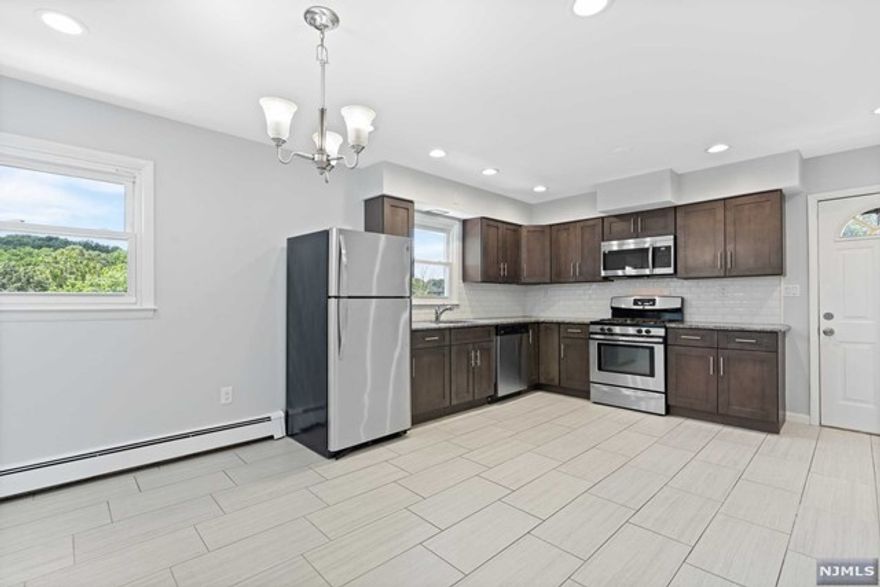 Welcome home to this bright & airy renovated second floor apartment located in a 2 family home on a quiet dead end street. This unit provides two entrances, a large modern eat-in kitchen equipped with stainless steel appliances, spacious living room, updated bathroom and 3 generous sized bedrooms. Hardwood floors throughout entire unit. Numerous closets along with a walk up attic provide ample storage. Laundry hook-ups located in the unit. Plenty of on street parking available. Conveniently located in proximity to Route 80, 46, shopping, restaurants and schools. 20 min drive to NYC.