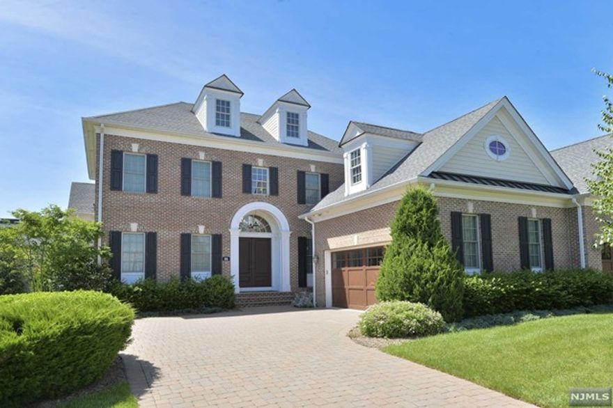 Sought after gated townhome community showcases this 4-bedroom, 4.5 bath move in ready gem with a 1st floor primary bedroom with high tray ceiling, lux bath w/oversized shower, free standing tub & radiant heat. Modern Eat-in Kitchen offers state-of-the art Jenn Air, Wolf & Bosch stainless steel appliances. There is a natural gas line for the rear patio. The 2nd floor offers a very large bedroom that can also serve as an additional primary bedroom suite w/state-of-the-art bath & large closet. There are 2 additional bedrooms, one with an en-suite bath and the other with access to bath. High ceilings throughout, elegant trim and architectural woodworking on all levels plus numerous upgrades. Finished lower level also has a full bath, large recreation room and massive storage. This townhome is elevator and generator ready. CAT5 wiring in all areas and security system. The Saddle River Grand offers a gated entry with security, pool, clubhouse & more!