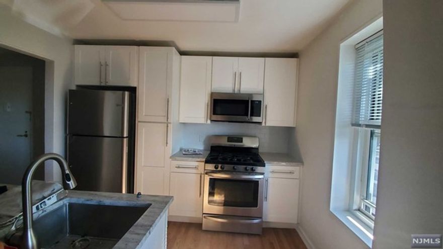 Quality renovation with a flair for design! Beautiful 2 bedroom condo with garage parking in the heart of Fort Lee. All new appliances including refrigerator w/ bottom freezer; custom light fixtures and finishes throughout. Heat and hot water included. Elevator building, on-sight laundry, park, bus stops, shopping, restaurants, George Washington Bridge, NJ Highway access and Palisades Parkway entrance within half mile radius. Move in/out fee and deposit required by building. Sorry, no pets. Owner holds NJ Real Estate License. Tenant screening link will be provided to applicants.