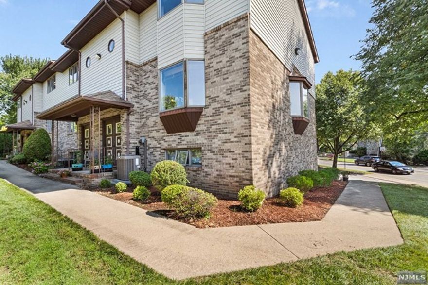 DREAM NYC COMMUTE! Discover the perfect blend of convenience and comfort in this expansive corner end-unit townhome. A one minute stroll to the NJ Transit bus stop. Bathed in natural light, this three-level home offers the perfect blend of suburban living with a dream commute steps from your door. The open-concept living area, adorned with stunning hardwood floors, seamlessly connects the kitchen, dining room , and living spaces, creating an inviting and cohesive environment. Living room has a large bay window. Culinary enthusiasts will appreciate the functionality of the kitchen's sleek stainless steel appliances. Retreat to the spacious primary bedroom, complete with an en-suite bathroom for ultimate comfort. Step outside to your deck from the dining room, ideal for relaxing afternoons or small gatherings. With an oversized 2-car attached garage, you'll enjoy secure parking and ample storage for all your needs.