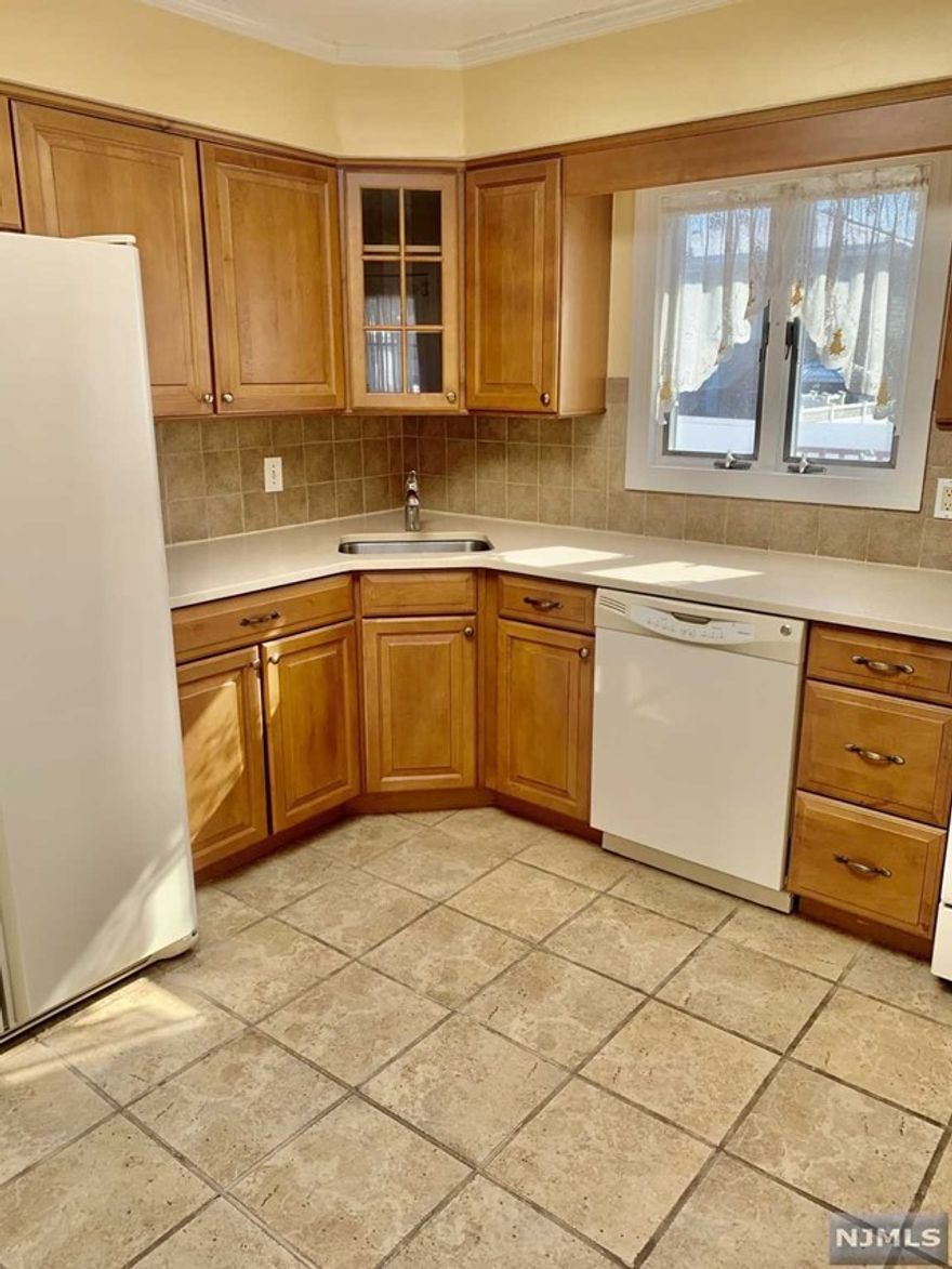 TRULY QUAINT AND SPOTLESS MOVE IN READY RANCH, OFFERING A WHOLE HOUSE TO YOU. WALK TO TRANSPORATION, QUITE TREELINED STREET. FIRST FLOOR IS OPEN EIK, DINING ROOM, LIVING ROOM, F/BATH, BDRM, BDRM LOWER LEVEL/BASEMENT IS A BEDROOM MASTER ENSUITE WITH FULL BATH, SUMMER KITCHEN, LAUNDRY AND FAMILY ROOM. GARAGE DETACHED ONE, PARKING FOR 2-3 CARS IN DRIVEWAY OVERSIZED FENCED YARD