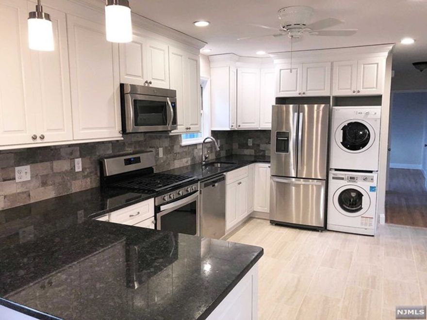 Larger updated three bedroom, one bath unit, off street parking, yard and washer/dryer in unit. Close to public transportation.