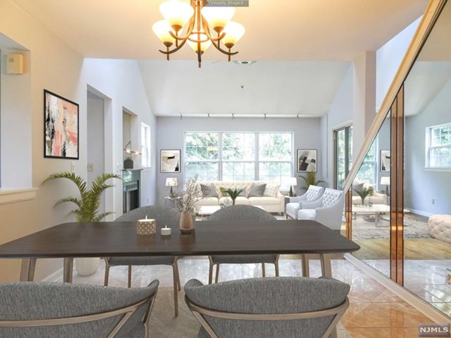 Spacious End Unit Town Home with new Improvements! Open Floor Plan on Main Level. Living Room with high Vaulted Ceilings has Skylights for abundance of natural light, cozy gas Fireplace, and access to private terrace. Updated Kitchen with Cherry Wood cabinets, Granite Ctrs/Breakfast Bar for easy dining and SS Appls. Laundry Closet, Full Bdrm and Updated Main Full Bath completes the main level. 2nd Level offers MstrBdrm with private Full Bath has Double Vanity, WIC, Stall and soaking tub to relax at end of day. 3rd Full Bdrm and 3rd Full Bath completes 2nd level. Alarm Syst can be activated for peace of mind. Hardwood Floors. Brand New Carpet installed on Stairway; Built-In Garg for convenient Covered Parking has Storage Closet. Near public transp, highways, shops and schools. Low HOA fees. A MUST SEE!