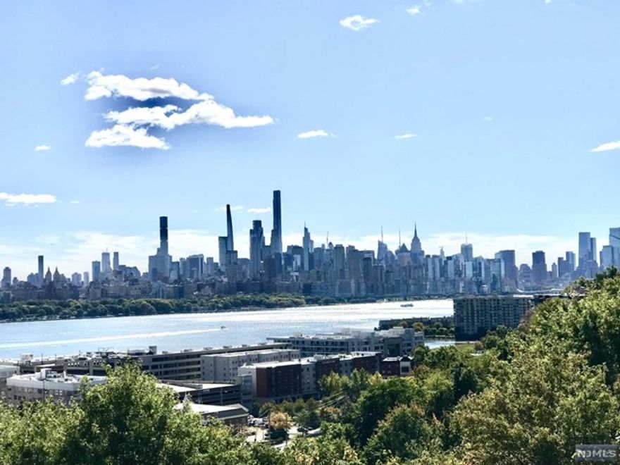 Welcome to this amazing house with a stunning view of MANHATTAN SKYLINE. Totally renovated house offers a modern open floor plan. First floor opens a living room featuring a fireplace and balcony overseeing NYC SKYLINE, formal dining room, gorgeous state of the art kitchen boasting sleek quartz countertops, stainless steel appliances and abundant cabinetry, powder room and laundry room. Second floor offers a master bedroom suite with its own full bath and more breathtaking NYC views and two additional bedrooms and a hallway full bath and plenty of closet spaces. This house features one car garage and one out parking space. Located just minutes away from NYC transportation and few miles from midtown Manhattan. This is a commuter delight location.