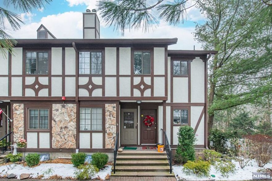 Your search has ended. This well-loved end unit is ready for you to add your personal touches and make it your own. Spacious living room/dining room with wood-burning fireplace to keep you cozy in winter plus rear balcony for private outdoor space. King size primary bedroom with 2 double closets plus Second bedroom/den/office. Eat-in kitchen with huge pantry closet plus dining area. Full size washer & dryer in designated laundry/utility room. Updated HVAC. E/W/S exposure for natural light and summer breezes. This unit boasts deep garage with separate huge storage room behind for security and privacy (not many units have this feature). Bring your pup or kitty - this is a pet-friendly complex. Walk along the paver paths surrounded by mother nature's beauty, meet your neighbors, enjoy the outdoors, swim in the pool, play a game of tennis or pickleball. Schools, Library & Shopping are nearby. Easy access to public transportation & highways. You will love to call this Your New Home