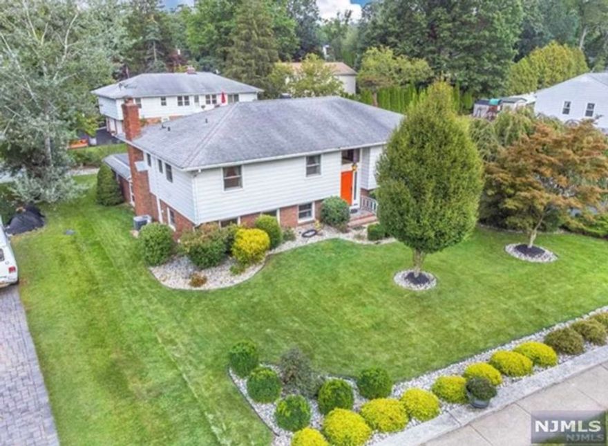 Over 3,000 S.F. Beautiful expanded Bi-Level w/many updates including a gorgeous large EIK on main level w/center island, granite, pendant lighting, SS appliances & sliders to a large trex deck. The main level features 3 bdrms, FB, formal living / dining room & kitchen. Mstr bdrm has a WIC & FB. Lower level features a Large IN-LAW SUITE w/sep entrance which includes a 4th bdrm & possibly 5th bdrm, liv/dining, kitchen, family rm w/gas fireplace, full bath. Add'l features include wood flooring, RA windows 2017 in main level & part of LL. Trex deck in 2019. New carpet in 2 bdrms upstairs. Driveway repaved. Roof on addition has a 10 yr transferrable warranty. Great pride of ownership shows throughout! Zoned Res'l/ Business for a home office. This home is a must see!