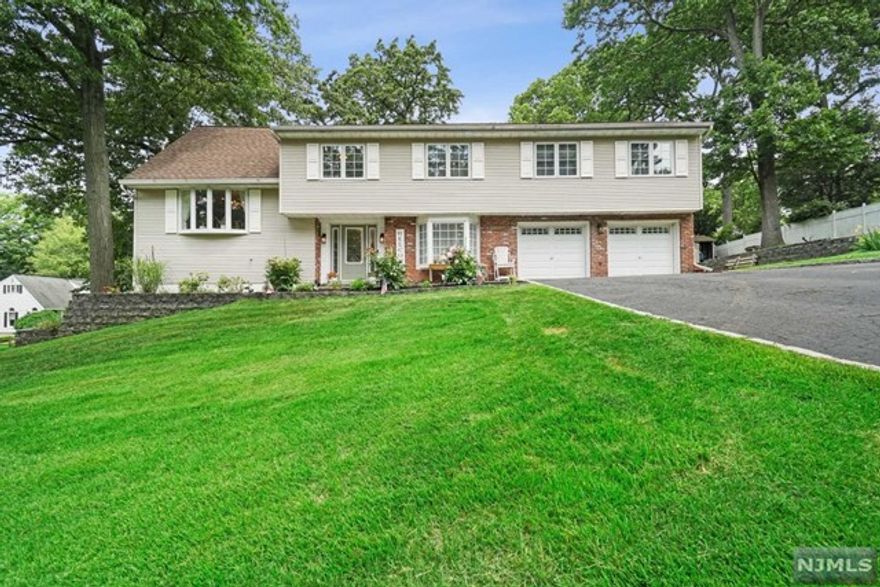 Updated 5 Bedroom 3 Full Bath Tri Level Split on Large property deep in a residential neighborhood. Family room with wood Burning Fireplace and full bath. Up a few steps to very spacious dining room and chefs kitchen with granite center island, Samsung French door Fridge with ice & water, Kenmore Oven, Whirlpool DW, Deep Double sink, Sliders to two tier deck overlooking large lush yard. Propane Grill included (as is) on deck. Up a few Steps to 4 bedrooms. Master is very big with cathedral ceiling, Walk in Closet, Spa bath with Jacuzzi tub. Top Floor has another bedroom 5th with walk in closet. Finished basement. Central Air. Excellent Schools and approx 27 Miles to Manhattan by car. 2 PETS ALLOWED. 2 Car garage with additional off street driveway parking.