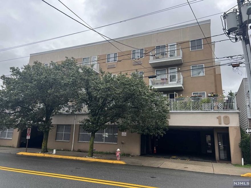 Charming Condo unit top floor w/ stunning rear balcony view to NYC skyline, featuring combo living/dining, kitchen granite counter top, fully loaded with SS appliances, 2 bedrooms, 2 full bathrooms, lots of closet space, all hardwood floors through out. Building has laundry on each floor, elevator, intercom access and one spot level 1 lobby parking garage.