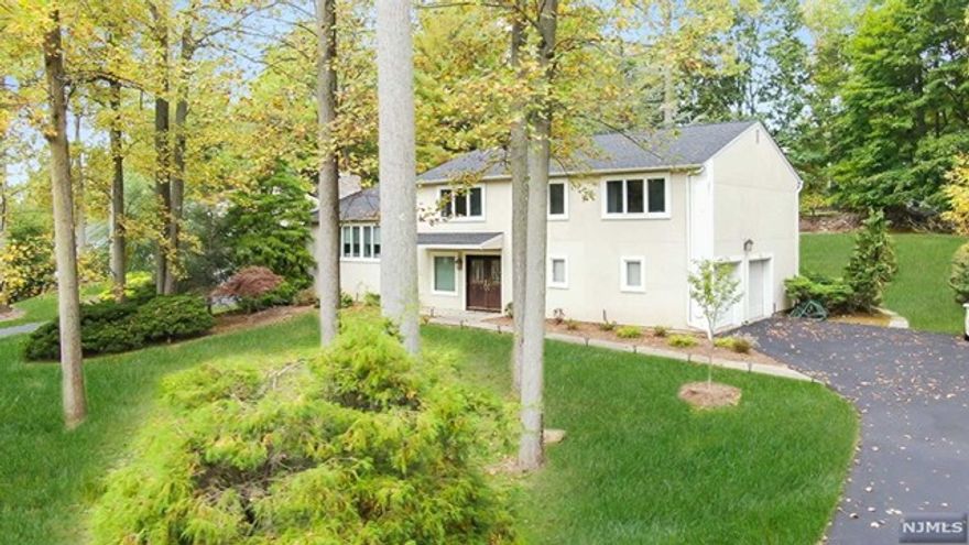 Immaculate contemporary colonial with bright and open floor plan in sought after location of River Vale. Large welcoming foyer into a banquet-sized dining room with sliding doors to the backyard. Laundry room and powder room complete this level. Second level offers an expansive living room including a gas fireplace. Large eat-in kitchen with center island, light wood cabinets and sliding doors to deck. Master suite featuring walk-in closet and full bath. Three additional bedrooms and an updated full bath completes third level. Fully finished lower level including family room, office and bonus room. Lush, professional landscape property offers a large deck and patio- great for entertaining. Two-car attached garage. Blue Ribbons schools! CLOSE TO SHOPPING AND NY TRANSPORTATION