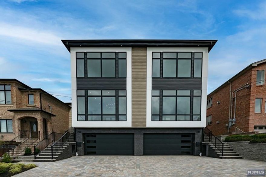 The most spectacular duplex ever built in Palisades Park! Side B of 73 W Homestead is truly expansive, offering 5 bedrooms and 5 full bathrooms with impeccable finishes throughout. The ground floor features a spacious den, two bonus rooms, a full bathroom, and a summer kitchen. The first floor boasts a light-filled great room with soaring 12' ceilings and 10' windows, creating an airy, open feel. The dining room overlooks the great room with sleek glass railings and includes a beverage center. The dream kitchen offers quartz countertops and a massive pantry. Upstairs, the primary suite features a walk-in closet and a spa-like en-suite bathroom. Two bedrooms share a Jack-and-Jill bathroom, while the fourth bedroom has its own en-suite. Laundry is conveniently located on the top floor, with an additional setup in the basement. The home also includes an oversized 2-car garage and so much more! Located in a desirable, convenient area close to public transportation and major highways!