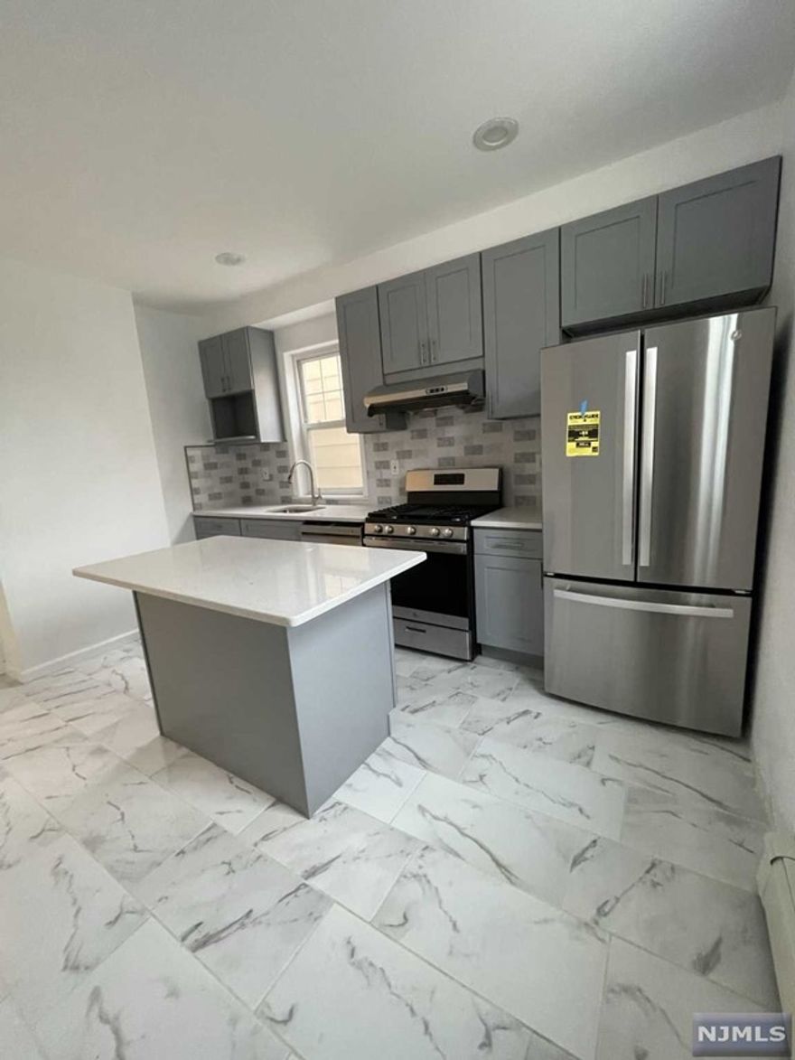 Completely renovated 1st floor apartment. Great location, 15 min walk to the path station. 3 bedrooms, living room, beautiful kitchen and bathroom. Stainless steel appliances and granite counter top center island. Close to shopping, schools and public transporation. Requires credit and background check along with month's brokers fee. Please text listing agent. Students are welcomed.