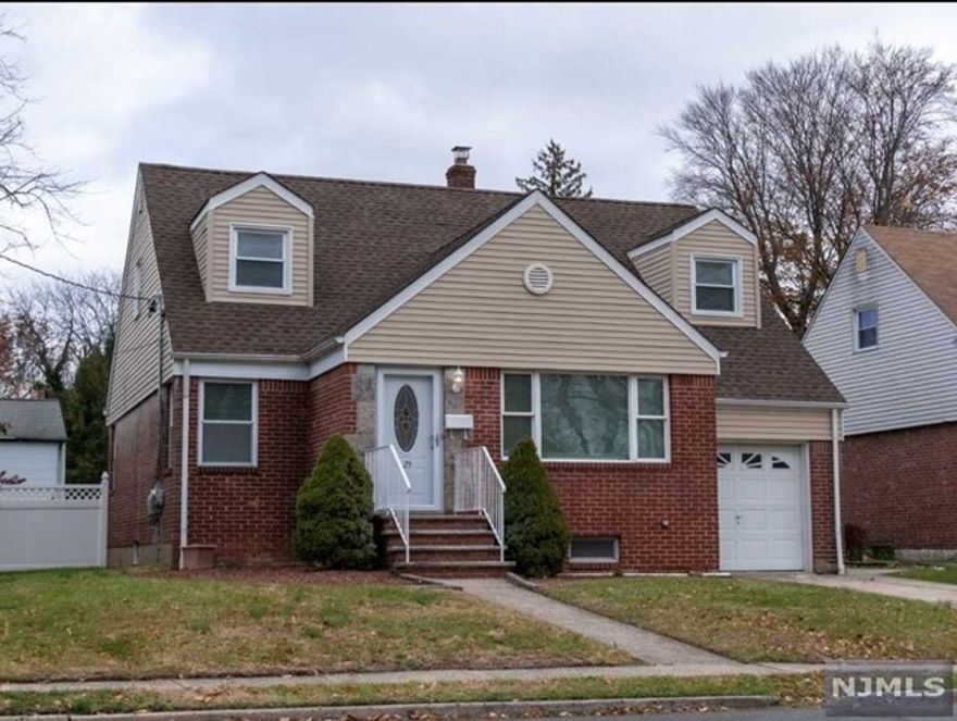 Move right into this 4BR - 2 Full Bath home on a great Street. Large Living room, MEIK, Den/DR, two good sized BR Full baths. Second floor features 2 Bedrooms, storage and Full Bath. Basement is Full and finished with a Laudrey room. Attached, 1 car garage, fenced in yard & Central air. Close to parks, shops, schools, NYC transportation and Highways. Credit Check and Interview required. No Smoking and No Pets.