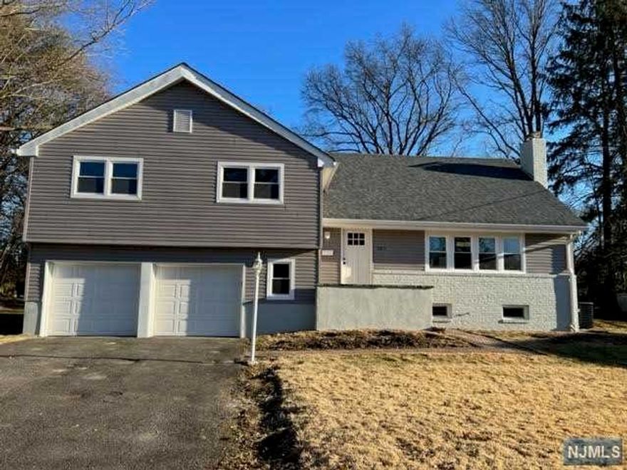 large 4 bedroom hone, 2 1/2 bths, with family room and finished basedment on one of Oradells most desired streets. Home has been just all renovated with open floor plan new kitchen/dining area, 3 new baths, beautiful hardwood floors, new siding, roof, driveway and landscaping will be done with weather prermitting, lots of closet space. The home offers new appliances in the kitchen, new windows throughout, central air, 2 car garage, and is conveniently located to everything. It is located on a super quiet street with homes of much higher value. The home has benn newly painted throughout. The living room is quite large, with a wood burning fireplace, and built ins. The bedrooms all have large closets, and the primary bedroom offers a walk in closet, 2nd closet, and a new full bathroom.