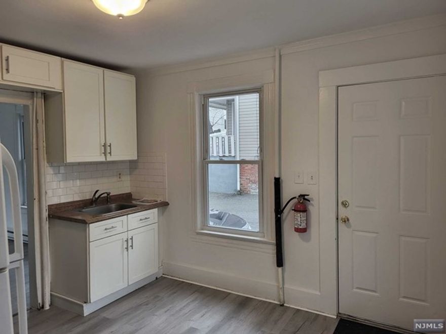 UPDATED 1st flr apartment, with separate entrance. 1 bdrm, 1 bath, Eat In Kitchen, Living Rm, with new flooring and updated Bathroom. 1 assigned off street Parking spot, Tenant use of shared laundry and storage in basement, w interior access to basement. Tenant pays all Utils. natural gas stove. Electric baseboard heat. Immediate availability.