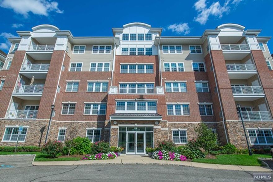 This spacious Colfax model ready for the next owner. An airy open floor plan welcome you to this move in ready home featuring hardwood floors, a gourmet kitchen with granite countertops and light colored finishes throughout. A large primary bedroom en-suite, primary bath with double sinks and stall shower. The home has a large second bedroom and bathroom, as well as a den and private balcony. This gated community is beautifully maintained and the building has a lot of recent updates. The Community has a clubhouse with a cafe, movie theater, art room, billiards, and gym, plus bocce, pickleball, tennis, indoor and outdoor pools. Maintenance includes internet, water, trash, common area, pools.