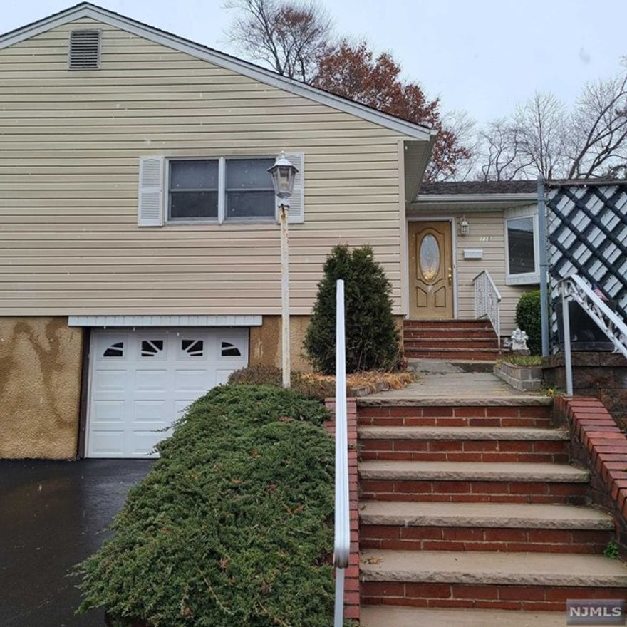 Beautiful bright(will be freshly painted) and spacious house for rent within walking distance to NYC train and bus, close to shopping and schools. PLEASE TEXT 201-873-8551 TO SCHEDULE THE SHOWING! The house offers: large kitchen with stainless steel appliances, plenty of extra storage space, hardwood floors in the bedrooms, bathroom with the shower and the tub, central air, extra fridge and laundry room in the finished basement with full bath, garage with additional parking space. Use of the private patio and the yard plus Weber outside grill. Washer/dryer provided! Just unpack and enjoy! A cat may be considered. Tenant is responsible for $200/month fixed utilities charges. Landlord is responsible for maintaining the lawn. No dogs, no smoking in the house. 1 bedroom apartment is attached to the opposite side of the house which is also rented.