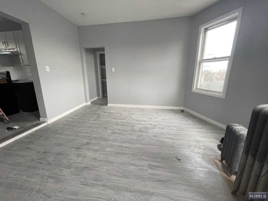 Newly renovated 1 bed 1 bath spacious living room and eat in kitchen with all utilities included