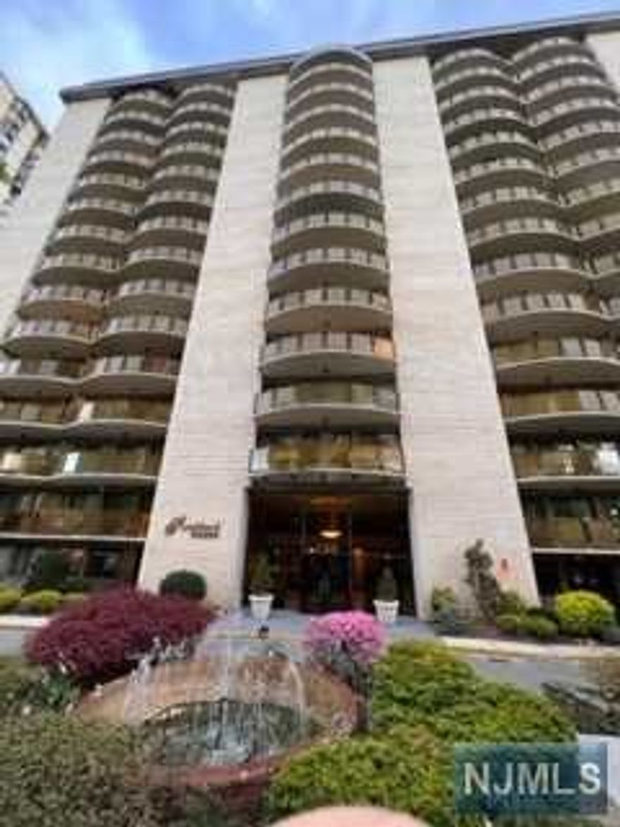 Luxury high rise Direct NYC View, Updated kitchen with WINE COOLER, Granite counter top, modern updated bath. Spacious and Very Well-kept Condo has Hardwood Flooring throughout Spacious terrace. Maintenance INCLUDES ALL UTILITIES, GARAGE PARKING SPACE($40). Laundry room each floor. Exercise gym. 24 hour doorman. NYC EXPRESS bus appx 2 blocks. Near NYC train & local bus service. Close to shopping, HUMC medical center. Parking is additional $40 Indoor/$30 Outdoor.