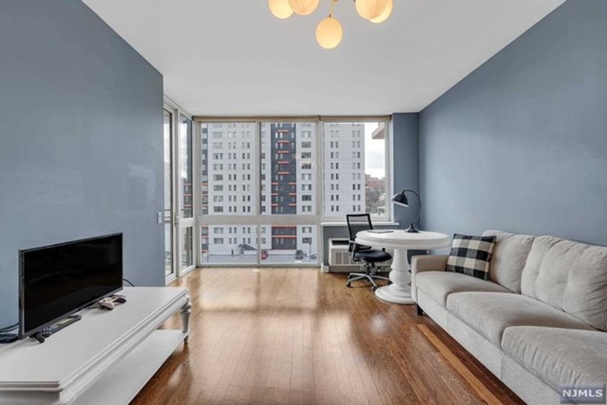 Experience contemporary sophistication in this stylish 1BD 1.5BA home bathed in southern sunlight situated in the heart of Edgewater. This meticulously designed home seamlessly blends modern aesthetics w/ functional living space. This home boasts an expansive FP characterized by HW floors throughout, complemented by floor-to-ceiling windows that infuses tons of natural light. The kitchen features modern SS appliances, granite countertops and ample cabinet space. The primary BDRM is generously sized, w/en-suite full bathrm. Step outside onto the capacious balcony,where you can bask in the view of NY/Hudson Rvr. It's the ideal spot to relish your AM coffee or unwind while taking in the PM views. The building also offers premium amenities, including 24HR concierge/DM service,common lounge areas,indr pool,2 gyms,yoga/pilates rm,kids playrm,furnished rftp terrace. Directly across from City Place,close to NYC transportation,shops,dining,parks.H,HW,Wtr,1 Pkg incl. Small pet is welcomed!