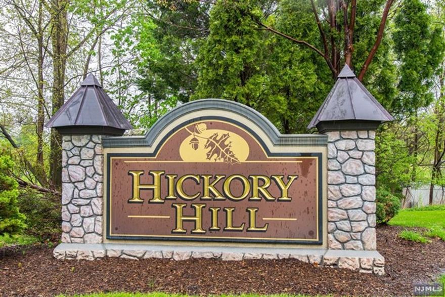 Rarely available gorgeous end-unit (Hemswell model), model unit for complex, located at the gate-guarded, highly desirable Hickory Hill. This 3 bed, 3 full & 1 half bath is loaded with upgrades (h/w floors, electrical, cabinets). Main fl features 2-story entry foyer, formal living & dining, cozy family room w/ frpl, & eat in kitchen (granite counters, stainless appliances, & center island), with doors out to awning covered patio, powder bath, and office. 2nd floor landing has spacious open-air overlooking foyer, sprawling master ensuite includes frpl, sitting area, tray ceiling, walk-in closet, and full bath with jacuzzi & dual sinks, 2 add'l bedrooms, newly renovated full bath, and lndry complete the 2nd floor. Full finished basement with high ceilings, add'l room, full bath, and utility room. Tons of storage! Amenities at Hickory Hill include 24hr security, heated pool, gym, clubroom with kitchen. Close to major highways, golf course, nyc bus at entrance. Watch video & tour!