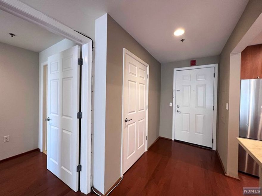 This spacious condo has 2 bedrooms, a den, and 1457 SqFt of living space with wood floors throughout. It features a modern open kitchen with limestone counters and stainless steel appliances, as well as an in-unit washer/dryer that has been professionally cleaned. The building offers 24-hour concierge services, garage parking without extra fees, and easy commuting to NYC via NJtransit buses. It is located by the Hudson River Waterfront Walkway, shops, cafes, and restaurants. DUE AT LEASE SIGNING: 1st month rent, 1.5-month security, 1-month broker fee *** minimum 2-year lease term & NO pets ***