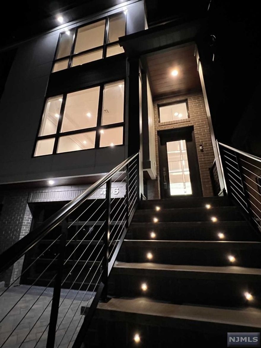 Welcome to 416 Lawton - a three-level luxury townhouse on one of the most desirable blocks Cliffside Park has to offer! The exquisite finishes truly stand out in this sun-drenched custom home - including hardwood flooring and custom crown moldings throughout. The spacious first level offers an airy living room with gas fireplace, formal dining room, powder room and a true chef's eat-in kitchen with sliding door deck access.Surround yourself in luxury on the second level with it's spacious primary bedroom with his and her closets, adjacent to a generous en-suite bathroom with a double vanity, and a large shower. 2nd floor laundry room for ease as well as two additional bedrooms and one full bath. Pull right into your ground level heated one-car garage. There's plenty of extra room including one full bathroom and a multi-purpose recreation room with a sink and mini fridge - leading to the private patio with a fenced in backyard. A commuters dream, 10 minutes to NYC! Why wait?