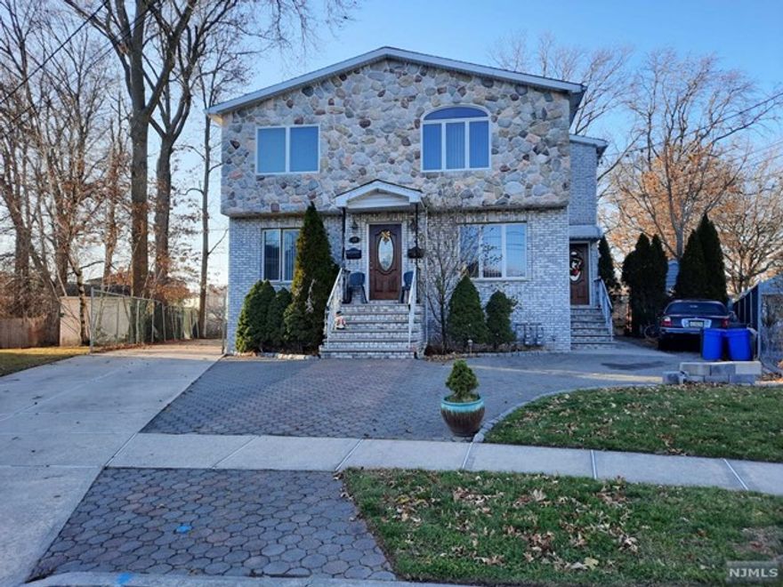 Large 1,735 sqf renovated townhouse-style 2 bedroom, 2 bathroom apartment on cul-de-sac. 1 st floor offers: living/dinning room combo, eat in kitchen with sliding door to the deck with awning and full bathroom. 2nd floor offers: master bedroom with walk in closet and balcony, master bathroom and another bedroom with wall to wall closet. Rooms are spacious and sunny, sparkling hardwood floors, central AC with 2 zones, 2 fireplaces, walk in closets, balcony off of master bedroom, deck off of eat in kitchen. Master bathroom with stall shower and jetted hot tub, equipped with separate room for toilet and bidet. Another full bathroom on the 1 st floor. Large laundry room in the basement could be used as gym. Use of very private back yard with basket ball court, driveway and at least 3 parking spaces. Close to Plauderville train station and walking distance to NYC bus stop, close to schools and shopping. Credit and background check, income verification, 1.5 month security deposit.