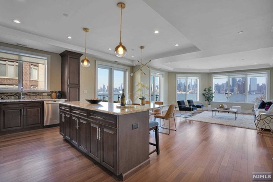 An exclusive private community enraptures you in this world-class luxury residence located at prestigious Henley on Hudson. Unobstructed panoramic views of NYC in a contemporary 3BR/3BA, 1,722sf residence to live for. Located on the NE corner, this home is flooded with natural sunlight. Features h/w floors, a chef's kitchen with granite counters, KitchenAid appliances, & open dining & living room with added bonus of a balcony. Inside the primary BR are direct NYC views, large WIC, & oversized ensuite BA. On the opposite side of the home is a second BR ensuite & a third BR with full BA. Two-car garage parking, upgraded A/C unit, & the beauty of astounding NYC/Hudson River views from your private terrace. The community is located along NJ's Gold Coast with the best commute & offers a concierge, 2 fitness centers, sauna, lounge, billiards, & patio room connecting to an infinity pool with views of the Empire State Building/Hudson River. Providing everything for your upscale lifestyle!