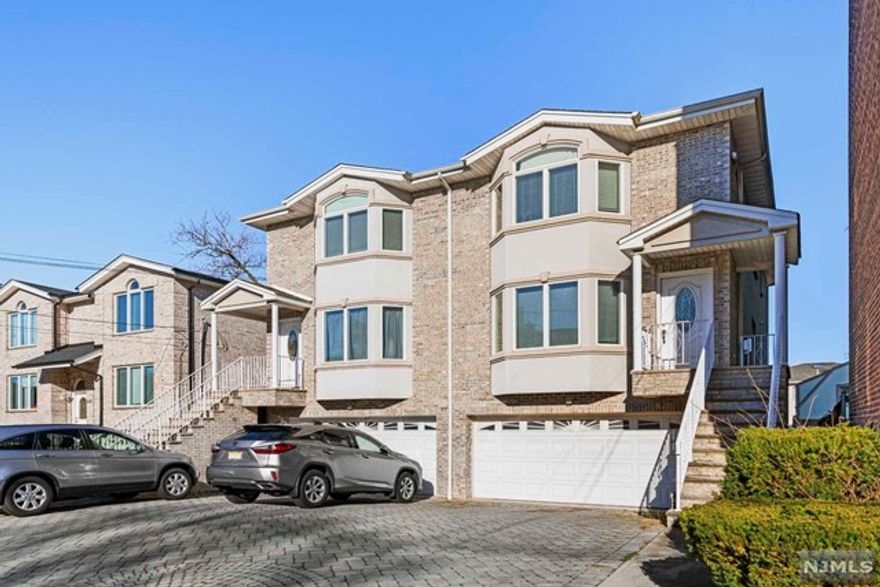 Step in to this well maintained and bright duplex in a prime location of Palisades Park. Unit offers an open layout with hardwood floors, living room with a fireplace, eat-in kitchen, and plenty of natural sunlight throughout the day. Ground floor includes 2 card garage with a tesla charger, a spacious studio/family room along with a full bath and a separate entrance. All bedrooms on the second floor are generous in size. Primary bathroom features a shower stall and a jacuzzi bathtub. Location offers incredibly easy access to NYC transportation, convenient shopping, and highways.