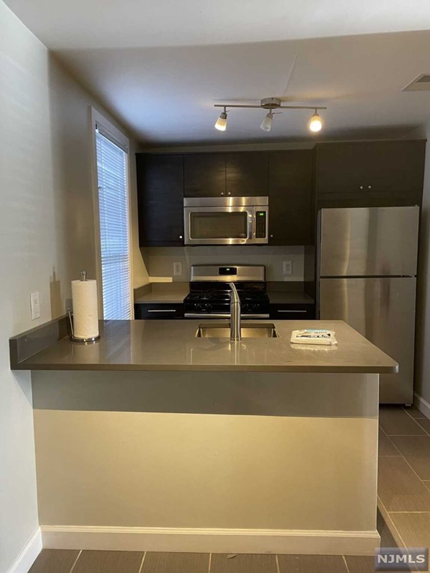 Renovated 2 bedroom apartment with classic Hardwood floors. New kitchen features stainless steel appliances and quartz countertops w breakfast bar and eat in kitchen. Master fits a king size bed, plenty of closets throughout. Steps from NY transportation, Hoboken and Jersey City. Washer/ Dryer in basement.