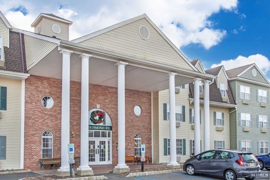 Welcome to this wonderful Stafford end unit model, privately located on first floor and in rear of building with beautiful view of grounds. Open floor plan. High ceilings. Multi-zone heating and cooling. Storage unit in basement. Spacious kitchen with breakfast bar open to dining room. Large living room also open to dining room. Master bedroom suite and additional en-suite with full bath. Laundry closet with full size washer and dryer. One parking spot with additional guest parking. The Grange Hall clubhouse offers an exercise room, billiards room, lounge area, pool, tennis courts, gazebo and more. Local to town center with shopping and restaurants.