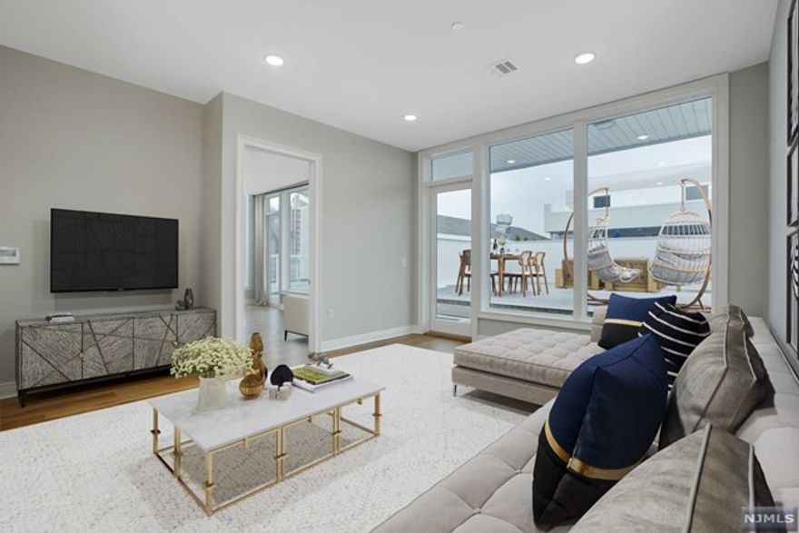 The Glass House offers residents a premier waterfront luxury lifestyle in the heart of Edgewater. Unit 601 includes 3 bedrooms, 2.1 bathrooms, and a spacious open layout. Each of the residences has spacious balconies, large oversized Marvin windows, 10ft ceilings, gourmet kitchens, including Subzero, Wolf & Bosch stainless steel appliances, Caesar stone countertops, and premium Kohler fixtures, a spa-like bathroom with soaking tub. Smart Home features such as the NEST Smart Home Thermostat System and Comelit Intercom System. Amenities include a Manhattan-facing outdoor swimming pool, courtyard, rooftop deck, fitness center that includes a yoga room, media room, children's playroom, Library, indoor lounge with fireplace, and a dog run. Glass House offers a concierge service, private ferry shuttle and express bus to Manhattan. Come and see this remarkable new community!