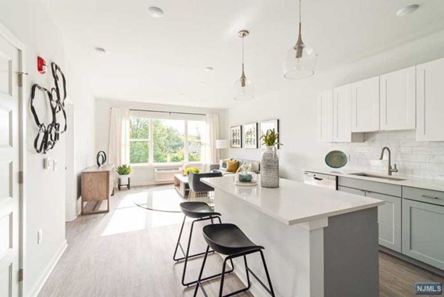 Bella - an oasis of luxury 1 & 2 bedroom apartments and lofts in the heart of Bergenfield. Conveniently located a few blocks from NY bus stops with sought after modern, luxury finishes - Bella is the latest talk of the town. Modern amenities include a welcoming two-story lobby with ButterflyFX system for easy entry using your mobile phone as a video intercom. Ground floor fitness center equipped with the essentials, including the latest Peloton bike. Take the elevator to the 3rd floor to the comfortable, common lounge room. WiFi enabled in all common areas. All apartments include quartz countertops, stainless steel appliances, washer/dryer, large bedrooms and closet space. Enjoy some sun or cool down during the evening and relax on the the beautiful rooftop deck. Come visit Bella and see for yourself!