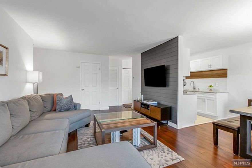 Beautifully updated 1 bedroom, 1 bath Condo located in the sought after Colonial Village condominium complex set in the wonderful town of Hillsdale. The entry foyer leads to the magnificent Kitchen featuring tiled floor, white cabinetry, stainless appliances, granite counters and a walnut & tile backsplash. The Kitchen opens to the lovely Dining Room and spacious Living Room, boasting a feature wall adorned with shiplap and incredible Brazilian Oak hardwood floors that continue into the bedroom. The large bedroom is light & bright and offers a walk in closet, with the adjacent refreshed bath featuring a beautiful vanity and new light fixture. Large Laundry Room is located in unit. Two entrances to the building for convenience, one of which is semi-private on a residential street. Pet friendly. Large private storage room. Plenty of guest parking. Close proximity to the town center featuring shopping, restaurants, parks & recreation. Easy NYC commute by car, bus and rail!