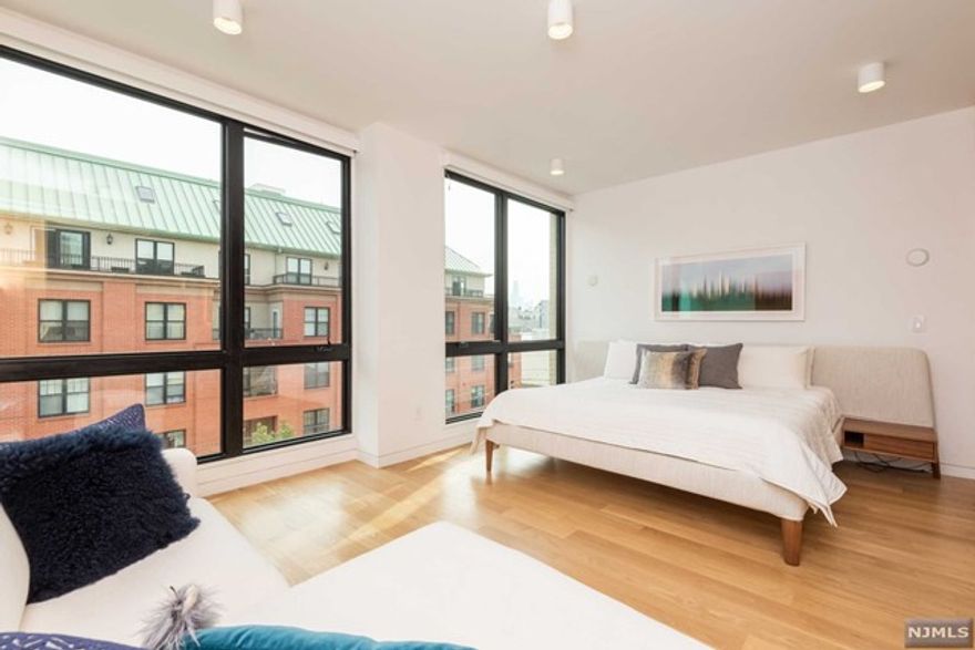 Appointed by the famed NYC design firm, FLOAT Studio, this building sets the bar for fresh, innovative living space. A rare partnership between boutique builder and the celebrated team that Architectural Digest has applauded, has crafted this new construction to bring some real excitement to the west bank of the Hudson! This 2456 sq foot steel and concrete duplex unit features 4 spacious bedrooms, 3 full bathrooms and private 800 square foot yard with turf grass. This cutting edge home features floor-to-ceiling windows, recessed lighting, wide plank douglas fir flooring and an abundance of storage throughout. Boasting an open-plan, the design features a gourmet chef's kitchen with caesarstone counters, top-of-the-line appliances including Miele refrigerator, Wolf range/oven, and Bosch dishwasher, perfect for entertaining or enjoying every square inch of it in private! Massive private storage room unit on ground floor! Not to mention, location, location, location!