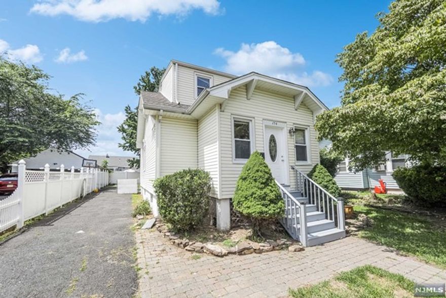 Welcome to this charming Bergenfield home with great curb appeal! On the first floor, a modern eat-in kitchen, two bedrooms, a full bathroom, a cozy living room, and a nice mud room. The second floor features, a large primary suite with a full bathroom and a large closet. The finished basement offers a recreation room, storage, and a laundry area. As you step outside, the fully fenced backyard ensures complete privacy and safety. Enjoy the seasons on your delightful deck, perfect for hosting barbecues and gatherings with family and friends. Conveniently located near NYC transportation, schools, and shopping. Freshly painted with new wood floors. Tenants are responsible for lawn maintenance and snow removal. This home is a must-see!