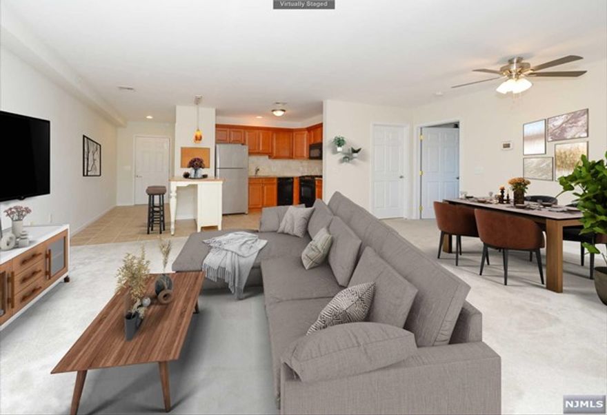 Walk in and fall in love with this large open concept condo! Space, room for entertaining and a balcony for outdoor enjoyment that provides distant views of NYC is among the extras that this home gives to you. The open floor plan with an updated kitchen including granite counter tops, marble back splash & GE appliances. It also boasts newer heating, AC & hot water heater. The one bedroom has a walk-in closet and laundry for your convenience. Stoneridge is a 55+ condo complex. This is a corner unit that provides extra privacy, The building offers a large community room with a big screen TV. This is a must see!