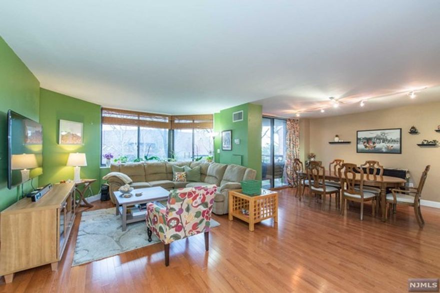 Welcoming 2 Bed, 2 Bath terraced condo in desirable, convenient, pet-friendly Harmon Cove Towers. Spacious open concept unit boasts one floor living w generous sized rooms, gleaming HW floors, updated designer EIK complete w island, newer appliances, granite counters & tons of storage. Master BR suite has oversized WIC, cushy wall-to-wall carpeting & attractive large master bath. Work from home in spacious 2nd BR. Laundry in unit! This home is truly bright and cheerful. Terrace overlooks lovely gardens. One deeded garage parking space is included. Inquire w management about availability of additional parking spaces & storage. Current owners pay $80/mo for 2nd space in garage. Extensive amenities include elevator, 24 hr concierge & security, fitness room, game room, beautiful outdoor pool, sauna, basketball/tennis courts & play area. Frequent buses to Port Authority & Secaucus Junction (train into NYC) at the gate of the comple. Near shopping, outlet mall, restaurants and more!