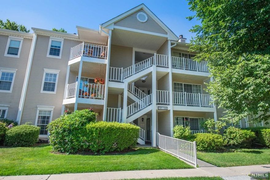 Welcome to this sunny & updated two-bedroom condo! This first floor, end unit, is located on a quiet cul-de-sac in the desirable Society Hill community. Hardwood floors throughout, sliding glass doors to patio, updated kitchen & full bath was recently remodeled in 2019 - there is nothing left to do but move right in. Two spacious bedrooms, one of which includes a large, walk-in closet. Enjoy the convenience of a washer and dryer in the unit. New hot water heater installed in 2019. This pet friendly complex offers lower taxes and association fees. You can walk to the pool, tennis courts or clubhouse. Assigned parking with ample guest spots, close to schools, shopping, NYC transportation. Showings begin Thursday, 7/7